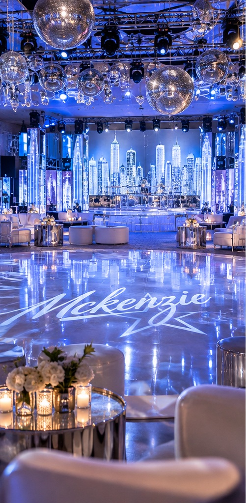 Mitzvah ballroom with mirror balls, city-skyline backdrop and a monogrammed dance floor